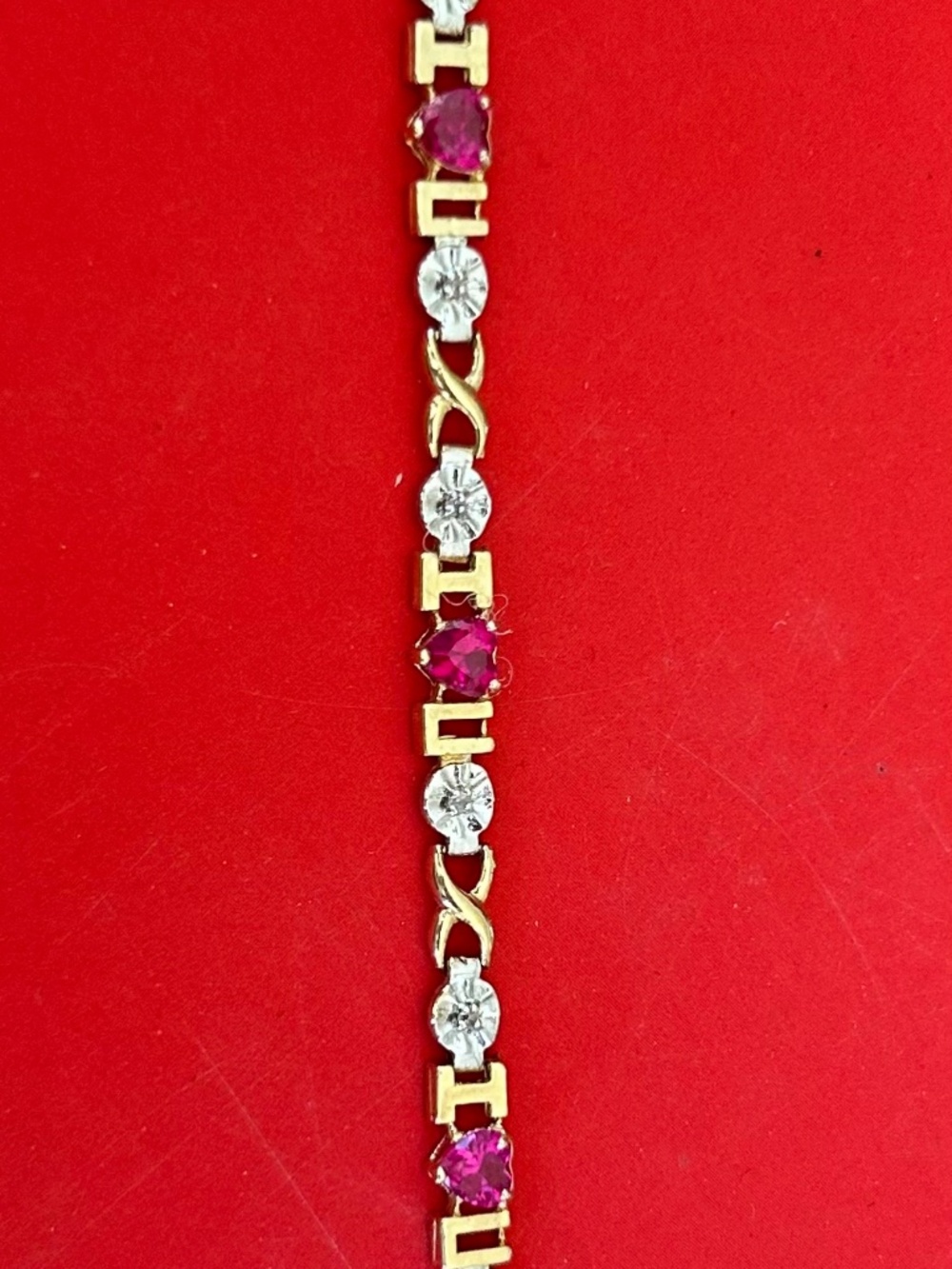 Gold, silver, ruby tennis bracelet